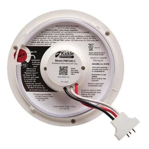 Back view of hardwired smoke detector with 9 volt battery backup for home safety, showing front load battery door and wiring.