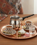 Turkish Warmer Coffee Pot 24 Ounce Stainless Steel 18 8 Professional Quality For Stovetop Turkish Coffee Cappuccinos Lattes Milk Warming And Butter Melting next to cups.