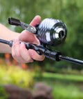 Close-up of Spincast Reel And 2 Piece Fishing Rod Combo With Durable Graphite Blank, EVA Handle, 6 Foot 10 Inch for freshwater fishing.