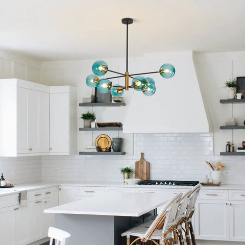 Blue Glass Globe Sputnik Chandelier 8 Light Modern Pendant Fixture For Dining Room Living Room Island Kitchen And Bedroom With Mid Century Vibe And Metal Frame in a kitchen setting.
