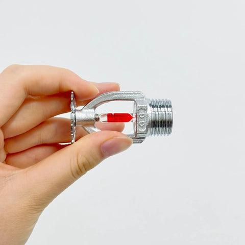Heavy Duty 5 Pack Fire Sprinkler Heads With Automatic Thermal Trigger At 155 Degrees Fahrenheit held in hand showing red glass trigger.
