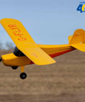 Champ Anniversary Edition 515mm RC Trainer Airplane BNF Basic With Safe Select Ready to Fly in flight over grass field