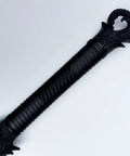 Dragon hilt close-up of unbreakable polypropylene martial arts sword with one piece blade black practice katana for role play and stage drama