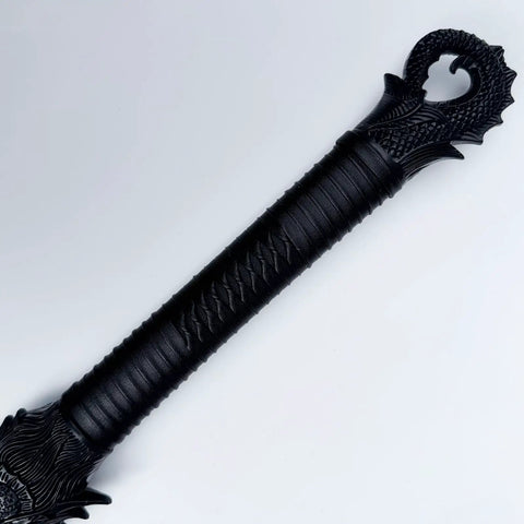 Dragon hilt close-up of unbreakable polypropylene martial arts sword with one piece blade black practice katana for role play and stage drama