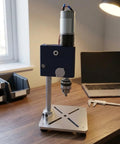 Bothyi Miniature Desktop Drill Press Workbench Tool feature close-up, metal housing, compact design on wood desk.