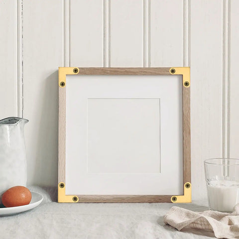 Upgrade Your DIY Builds With These 8 Piece Bronze L Shaped Corner Brackets built tough for rust resistance on a picture frame.