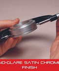 Hands holding an outside micrometer with advanced sleeve design and satin chrome finish, highlighting its no-glare feature.