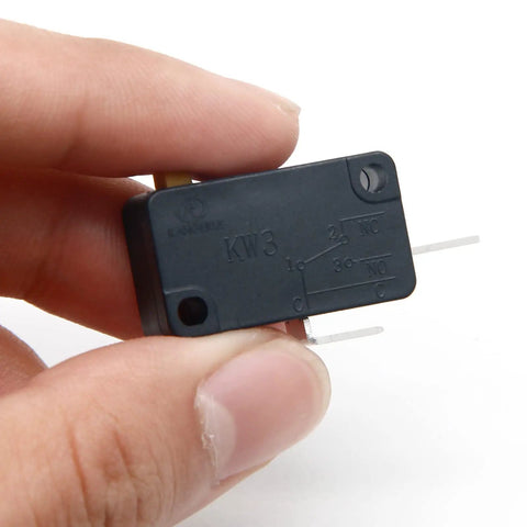 Person holding KW3 Snap Action Switch Normally Open 125V/250V Micro Limit Switch for Air Fryers, Microwaves, Vacuum Cleaners
