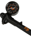 Fox Factory HP shock pump close-up with gauge and swivel head, black body, orange Fox logo, 350 PSI