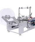 Straight Up Reliable Semi Automatic Bottle Labeling Machine With Fast Electric Label Applicator For Round Containers Featuring Rock Solid Fiber Sensor Setup Perfect For Glass Plastic And Metal Bottles 20 To 120 Mm, side view showing clear label roll.