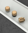 Three 6 Pack Matte Black and Champagne Bronze Knurled Cabinet Knobs for Kitchen Cabinets and Dresser Drawers on display