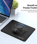 Ultra Smooth Gaming Mouse Pad With Dope Anti Fray Stitching Waterproof Surface And Non Slip Rubber Base Stitched Edges Works With Laser And Optical Mice Perfect For Laptop Setups next to a laptop