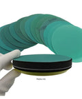 30 Piece 5 Inch Hook And Loop Sanding Discs With Green Abrasive Film displayed with a hand holding one disc, showing variety.