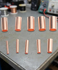Get Your Hands On 250 Pcs Copper Tube Butt Wire Ferrules With Assorted Sizes From One To Six Millimeter For Crimping Electrical Wiring Terminals In Cars Trucks And Industrial Machinery Kits Stored Neatly. Assorted copper tube butt wire ferrules in multiple sizes on a workbench