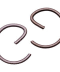 Close-up of metal clips from The Duke's Piston And Cylinder Set For Hilti DSH-900 And DSH-900X Replacement Kit With Nikasil Coating.
