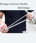 Person holding No Sweat Heavy Duty Stainless Steel T Hook Lifter For Manhole Covers Drain Grates Storm Sewers Rolling Shutters Built Tough Utility Access Tool Wrench 34 Inches Long.
