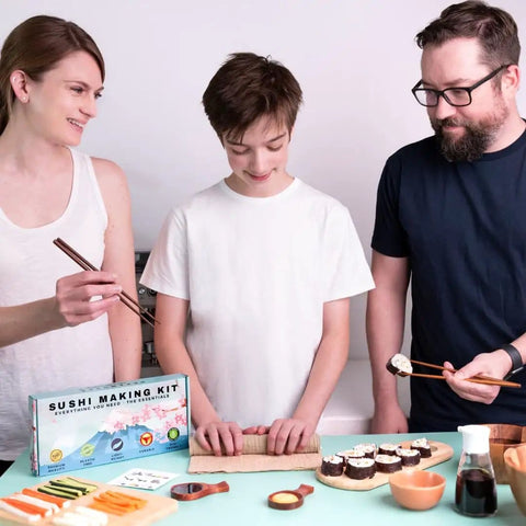 Family using Premium Wood No Plastic Sushi Making Kit For Home Use Beginners To Pro Chefs Includes Bamboo Mats Rice Paddle Rice Spreader Tea Cloth Chopsticks And More Eco Friendly DIY Gift For Sushi Lovers