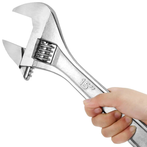 Hand holding a Must Have 15 Inch Adjustable Wrench Set With Wide Jaw, Heavy Duty Crescent Tools, Ergonomic Handles, Forged Steel Chrome Plated.