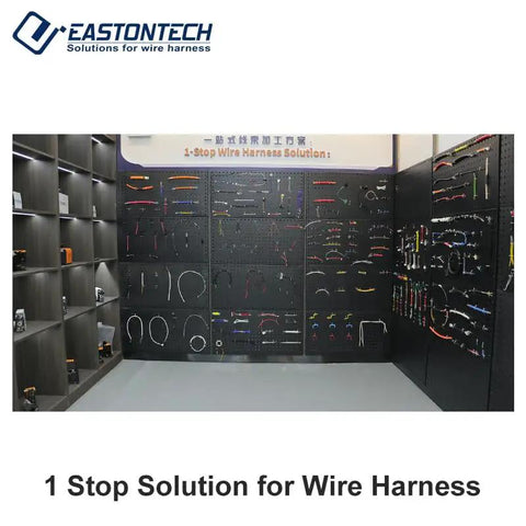 Display of various wire harness solutions in a workshop setting, showcasing organization and variety.