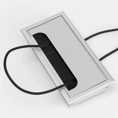 Premium Aluminum Desk Cable Grommets 10 Pack With Soft Rubber Inserts Keeps Your Wiring Organized Prevents Fraying And Protects Cords From Sharp Edges For A Super Clean Setup. silver rectangular desk cable grommet with cords passing through
