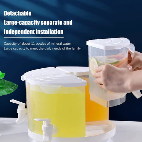 Five Point Five Liter Rotating Beverage Dispenser With Four Separate Compartments And Dripless Spigot showing clear liquid and slices of lime.