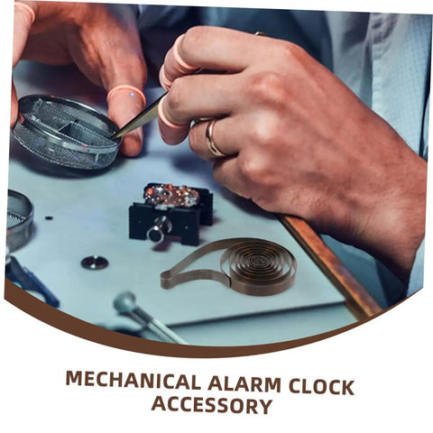 Hands working on clock mechanism with 4 Pack Steel Clock Main Springs For Mechanical Clocks Replacement Parts visible on table.