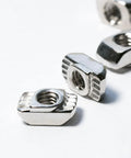 Close-up of 200 Pack 2020 Series M3 T Slot Nuts Hammer Head Fasteners Nickel Plated Carbon Steel