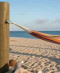 Hammock secured to wooden post using Eye Bolt 3/8 Inch By 4 Inch Zinc Plated, 10 Pack For Indoor And Outdoor Use at beach