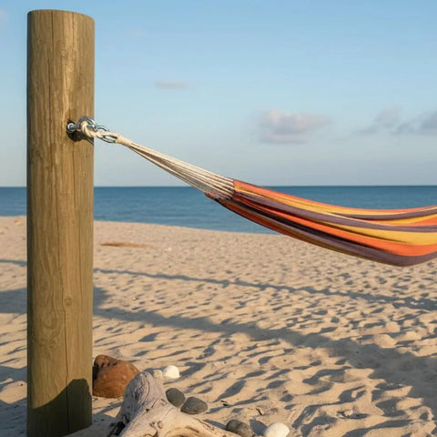 Hammock secured to wooden post using Eye Bolt 3/8 Inch By 4 Inch Zinc Plated, 10 Pack For Indoor And Outdoor Use at beach