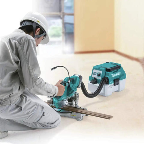 Worker using XCV11Z 18V LXT Brushless Cordless 2-Gallon HEPA Wet Dry Dust Extractor Vacuum in shop