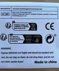 Manufacturer details and recycling instructions on a white paper warning for fragile deliveries made in China.
