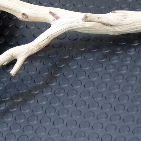 Coin Pattern Rubber Flooring 3.5mm Thick 36 Inch By 10 Foot Sheet Dark Gray with wood branch on anti-slip surface