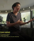 Unknown person sitting in a studio with cameras in the background, discussing film projects.