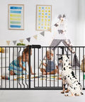 Walk Through Baby Gate For Stairs, Adjustable 38.5 To 43.5 Inch Wide, Pressure Mounted Safety Gate, black, shown with toddlers and dog