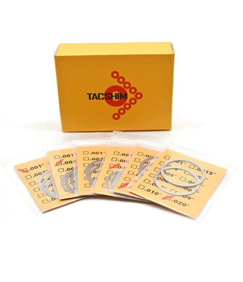 Premium Slick Heavy Duty Barrel Nut Shim Kit With Twenty Badass Precision Pieces For Flawless Rail Alignment and Rock Solid Torque On 556 And 223 Rifles with shims in packaging.