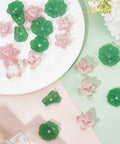 Dope Lotus Acrylic Beads Set, 24 Pieces In 7 Styles, 10-30mm Mini Flower And Leaf Beads for jewelry making displayed on a table