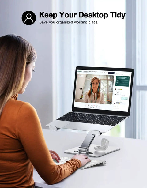 Woman using a laptop on a foldable laptop stand with height adjustable ergonomic riser, aluminum portable desk mount for 10 to 16 inch laptops