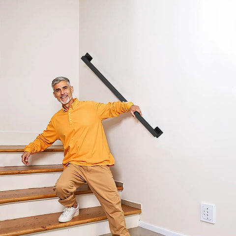 Badass Industrial Wall Mount Stair Handrail, Three Foot Black Iron Staircase Grip Square Tube on indoor stairs with user.