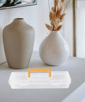 Straight Up Plastic Tool Box With Sturdy Carry Handle Divided Multi Purpose Compartments For Weekend DIY Projects Hardware Sorting Paint Brush Holder And Small Gear on a table with decorative vases.