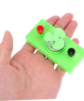 Hand holding green mini turbine from Solar Powered Science Experiment Kit For Kids With Mini Generator Motors Hand Cranked Wind Turbine.