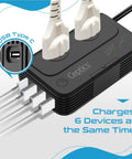 Six In One Travel Adapter And Voltage Converter With Surge Protection for 220V To 110V Countries, showing 6 device charging.