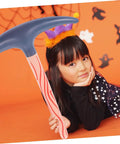 Child posing with Inflatable Pickaxe 4 Pack for Party Favors and Pranks, Safe PVC Material, Easy to Inflate, Totally Reusable