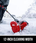 Badass Brushless 40 Volt Cordless Snow Shovel Kit With A Meaty 12 Inch Deck clearing snow with 12-inch auger in use.