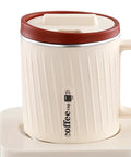Electric Coffee Warmer And Dual Cooling Mug Goes Hard Keeping Your Drinks Hot Or Cold Exactly When You Want Them in milky white and red.