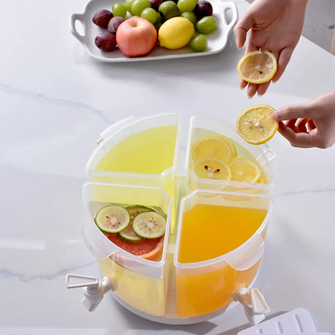 Five Point Five Liter Rotating Beverage Dispenser With Four Separate Compartments And Dripless Spigot filled with drinks and garnished lemon.