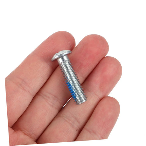 Close-up of a single screw from the 6 Pcs Roller Skate Stopper Screws For Quad Skates Replacement Parts With Easy Installation And Brake Accessories Ideal For Skating Shoes Maintenance And Enthusiasts Seeking Durable Metal Screws, held in hand.