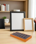 Slick Gray Solid Wood Jewelry Display Tray Featuring 12 Ring Slots Top Shelf Storage Organizer Box displayed on a desk.