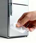 Heavy Duty Clear Plastic Shims And Leveling Wedges For Wobbly Toilets Furniture And Appliances Trim To Fit Stackable Non Slip Stabilizers being inserted under a refrigerator.