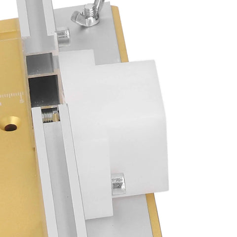 Close-up of Precision Router Table Lift System Height Adjustment Base with white insert plate and sliding ruler, aluminum build.