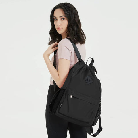 Woman carrying a Drawstring Gym Backpack With Separate Sneaker Compartment, Large Capacity Sports Bag For Workout And Travel, black color